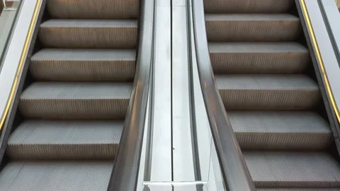 Bottom view of empty escalator steps moving up and down in shopping center Stock Footage 209600611