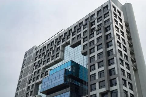Bottom view of the facade of a modern building with many glass windows Fotos de archivo