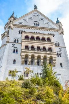 Bottom view of the facade of the old castle with balconies with columns Stock Photos
