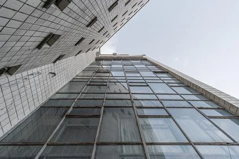 Bottom up view of the facade of an old Soviet modernist building Stock Photos