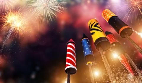 Bottom view of fireworks rockets launching into the sky Stock Photos