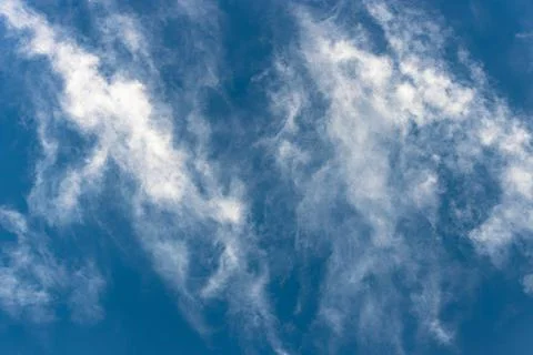 Bottom view of fluffy white cloud on deep blue sky Stock Photos