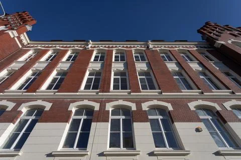 Bottom view of the front wall of the historic red brick building. 写真素材
