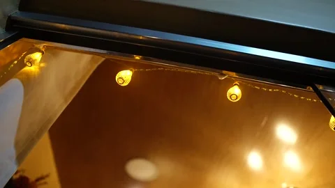 Bottom view of golden lights at the store entrance. Stock Footage 142669848