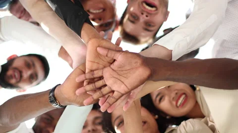 Bottom view. group of happy young people making a stack of hands Stock Footage 221914168