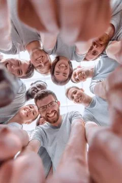 Bottom view. group of successful young people looking at the camera Stock Photos