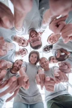 Bottom view. group of successful young people looking at the camera Stock Photos