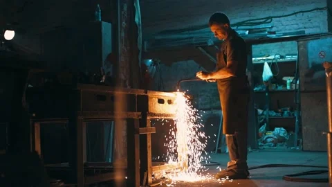 Bottom view of the hands of a worker cutting metal with an oxy-fuel torch. Stock Footage 229325798