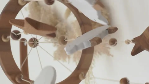 Bottom-up view of hanging mobile on crib Video stock 229166866