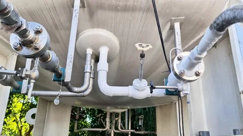 Bottom View of Heavy Equipment and Piping Valves in a Chemical Processing Plant Video stock 337723070