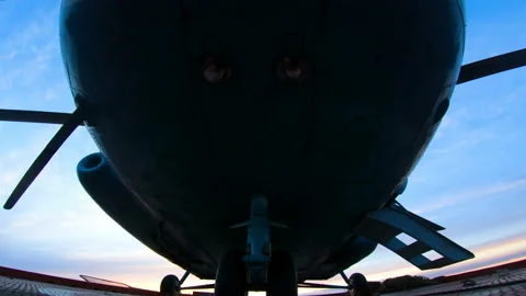 Bottom view of the helicopter. Helicopter's propeller begins to spin. The ladder Stock Footage 148447455