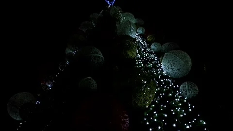 Bottom up view of a large Christmas tree in the night city. Stock Footage 144956557