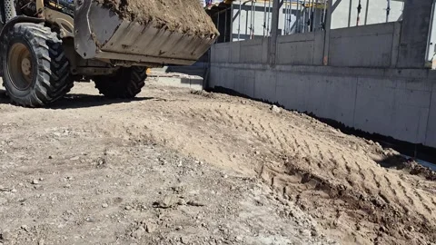 Bottom View of Large Construction Vehicle Moving Earth Stock Footage 334993883