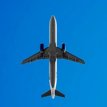 Bottom view of large passenger plane Stock Photos