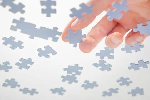 Bottom View. Male Hands Assembling Jigsaw Puzzle. Pastime, a hobby. Complex 스톡 사진