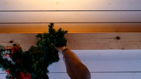 Bottom view, a man decorates the house with New Year's decorations Video stock 295154258