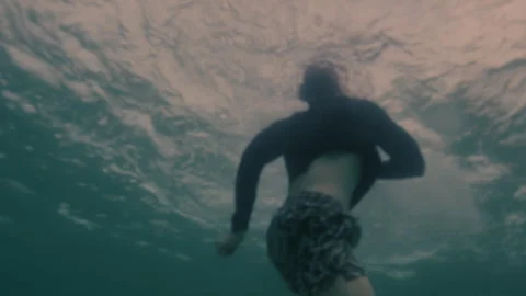 Bottom view of a man drowning in the ocean Stock Footage 264021287