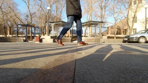 Bottom View Of Man Legs  On The Paving Stone. Stock Footage 87574166