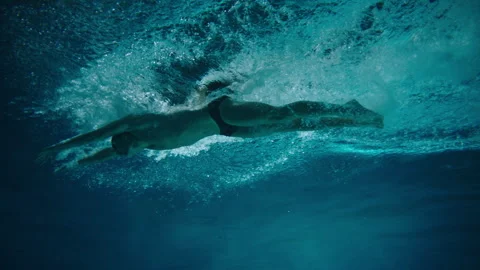 Bottom view of a man in the pool Stock Footage 283138933