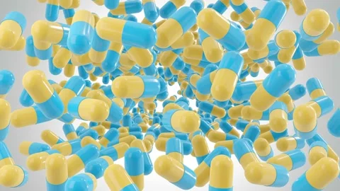Bottom view of many capsule pills drop from the top in a different positions Stock Footage 133714110