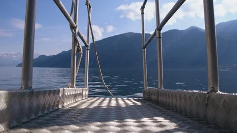 Bottom view of metal pier or boardwalk in Como lake in Italy, mountain lake Stock Footage 114831246