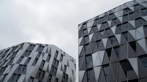 Bottom view of modern unique building with triangle shaped windows of black Video stock 116233834