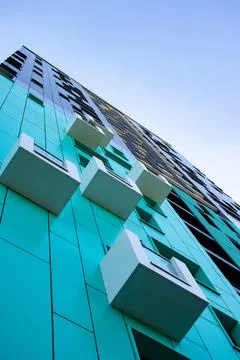 Bottom view of a multi-storey modern blue building . urban jungle Stock Photos