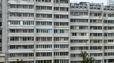Bottom view of a multi-storey panel residential building. City life view. Stock Photos