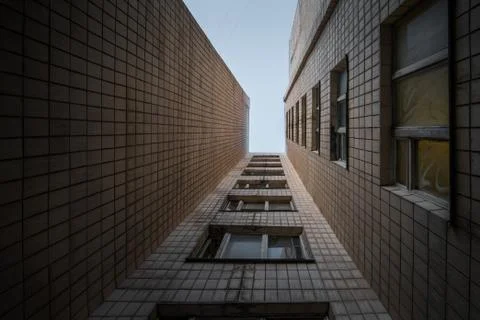Bottom-up view of a multi-storey Soviet apartment building, an old abandoned  Stock Photos
