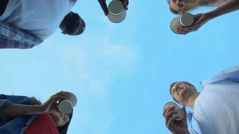 Bottom view of multiracial friends clinking cocktails, having fun outdoors Stock-Footage 117215880