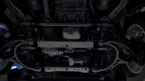 Bottom view of new car at service station showing suspension and chassis, Video stock 330987872