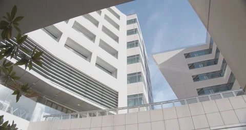 Bottom view of office building against the background of the blue sky Stock Footage 265779453