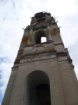 Bottom view of the old bell tower in the Russian village. Stock Photos