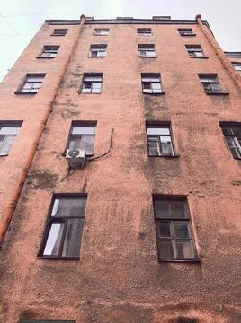 Bottom view of the outer wall of the house with lights Stock Photos