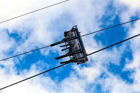 Bottom view of pair skiers on chair lift Stock Photos