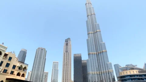 Bottom view of panorama Burj Khalifa at blue sky in tourist district of Dubai Stock Footage 255728592