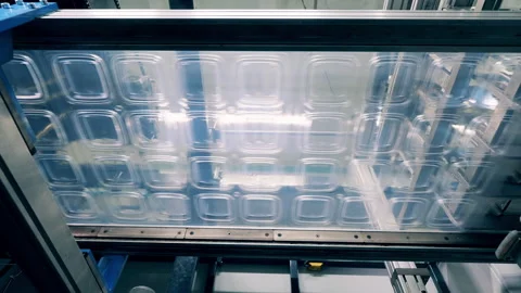 Bottom view of a plastic lid production line Stock Footage 150196211