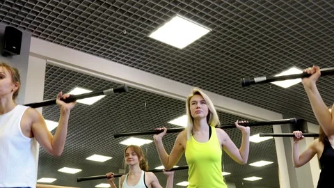 Bottom View Of Positive Charming Young Women Squat With A Barbell Stock Footage 108688724