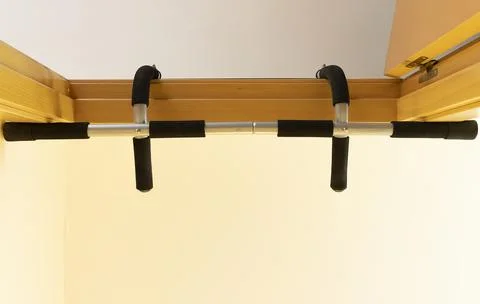 Bottom view of a pull-up bar set in a doorway Stock Photos