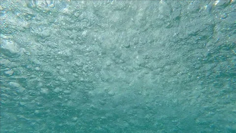Bottom view of rain drops dripping on the water surface, Underwater shot,  Slow Stock Footage 295266353