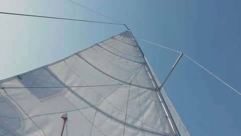 Bottom view of the raised sail. a sail filled with wind. white sail of the yacht Stock Footage 205925208