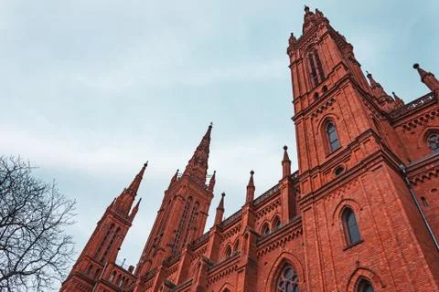 Bottom view of a red brick catholic church. Foto stock
