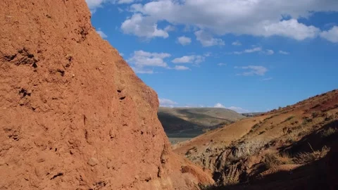 Bottom view red sandstone canyon against blue sky. Stockbeeldmateriaal 218086268