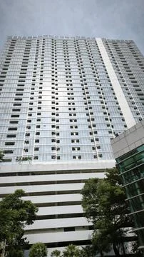 Bottom up view reflective skyscraper modern city building Stock Photos