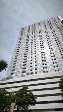 Bottom up view reflective skyscraper modern city building Stock Photos