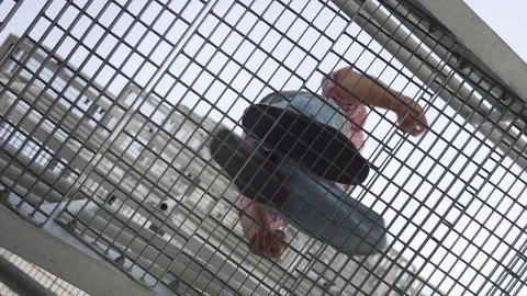 Bottom view rotating camera man going up... | Stock Video | Pond5