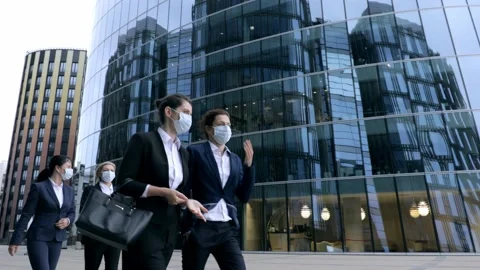 Bottom view serious middle aged business colleagues talking outdoors Group of Stock Footage 135825157