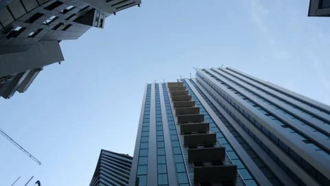 Bottom view of several beautiful skyscrapers against the sky. Stock Footage 239455100