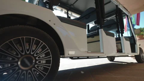 Bottom view shot of parked white golf cart waiting for tourists arrival or Stock-Footage 269982896