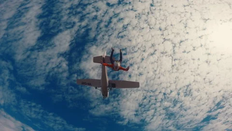 Bottom view of a skydiver jumping from a plane Stock Footage 264503418